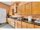 Spacious kitchen with granite countertops, wood cabinets, and stainless steel hood at 4105 37Th E St, Bradenton, FL 34208