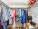 Walk in closet with ample storage and shelving at 4203 Schwalbe Dr # 115, Sarasota, FL 34235