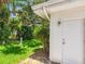 The condo features a white exterior with a view of the green yard at 4203 Schwalbe Dr # 115, Sarasota, FL 34235
