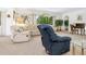 Inviting living room featuring comfortable seating, large windows, and abundant natural light at 4203 Schwalbe Dr # 115, Sarasota, FL 34235