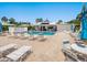 Charming pool area with ample lounge chairs, umbrellas, and seating, ideal for community gatherings at 4203 Schwalbe Dr # 115, Sarasota, FL 34235