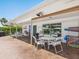 Comfortable poolside patio with seating, offering a perfect spot for relaxation and enjoying the community pool view at 4203 Schwalbe Dr # 115, Sarasota, FL 34235