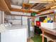 This storage room includes shelves, a washer, and a water heater at 4203 Schwalbe Dr # 115, Sarasota, FL 34235
