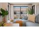 Cozy balcony space with comfortable seating and a view of neighborhood buildings at 4411 46Th W Ave # 201, Bradenton, FL 34210