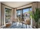 Charming balcony with comfortable seating area that overlooks a serene pond and palm trees at 4411 46Th W Ave # 201, Bradenton, FL 34210