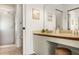 Bright bathroom featuring a vanity and a step-in shower with glass door at 4411 46Th W Ave # 201, Bradenton, FL 34210