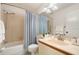 Bathroom with a tub and shower combo, white toilet, and a faux stone vanity counter at 4411 46Th W Ave # 201, Bradenton, FL 34210