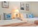 A comfy bedroom features two beds, coastal-themed decor, and ample natural light for a serene ambiance at 4411 46Th W Ave # 201, Bradenton, FL 34210