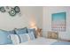 Bedroom decor with calming color palette and beachside accents at 4411 46Th W Ave # 201, Bradenton, FL 34210