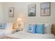 Close up of two twin beds with wooden frames and coastal themed pillows and art work at 4411 46Th W Ave # 201, Bradenton, FL 34210