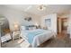 Bright bedroom featuring a king size bed and ensuite bathroom with modern finishes at 4411 46Th W Ave # 201, Bradenton, FL 34210
