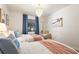 Comfortable bedroom showcasing two beds, modern decor, and a bright window for natural light at 4411 46Th W Ave # 201, Bradenton, FL 34210