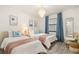 Charming bedroom with two beds, stylish lighting, and coastal-themed decor for a relaxing ambiance at 4411 46Th W Ave # 201, Bradenton, FL 34210