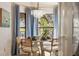 Dining area with modern chandelier, table setting, and bay window view at 4411 46Th W Ave # 201, Bradenton, FL 34210