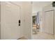 Bright foyer with tile floors leads to a dining area and closet at 4411 46Th W Ave # 201, Bradenton, FL 34210