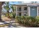 Well-maintained two-story condo building featuring lush landscaping and visible unit number at 4411 46Th W Ave # 201, Bradenton, FL 34210