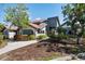An eye-level exterior shot of a two story building, surrounded by a yard and trees at 4411 46Th W Ave # 201, Bradenton, FL 34210