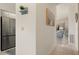 Hallway with tile flooring showing entrance to living room and stainless fridge at 4411 46Th W Ave # 201, Bradenton, FL 34210