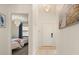 Bright hallway leads to a bedroom, showcasing a clean aesthetic with tile flooring at 4411 46Th W Ave # 201, Bradenton, FL 34210