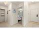 Hallway with tile floors showcases bedroom entrance and closet space at 4411 46Th W Ave # 201, Bradenton, FL 34210