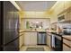 Well-equipped kitchen featuring stainless steel appliances and sleek countertops, offering a blend of style and functionality at 4411 46Th W Ave # 201, Bradenton, FL 34210