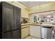 Updated kitchen with stainless steel refrigerator and appliances offers functionality and style at 4411 46Th W Ave # 201, Bradenton, FL 34210