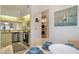 Charming kitchen with stainless steel appliances, adjacent to a dining area with seating and views to in-unit laundry at 4411 46Th W Ave # 201, Bradenton, FL 34210