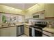 Well-equipped kitchen with stainless steel appliances and a functional layout for cooking and entertaining at 4411 46Th W Ave # 201, Bradenton, FL 34210