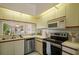 Bright kitchen with stainless steel appliances, light cabinetry, and functional design for efficient meal preparation and storage at 4411 46Th W Ave # 201, Bradenton, FL 34210