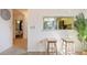 Bright living area with tile floors, breakfast bar and stools, and a view of the kitchen and dining area at 4411 46Th W Ave # 201, Bradenton, FL 34210