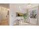 View of an open floor plan with modern stools, kitchen view, and abundant natural light at 4411 46Th W Ave # 201, Bradenton, FL 34210