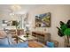 Bright living room with neutral furniture, a television, and open concept design at 4411 46Th W Ave # 201, Bradenton, FL 34210