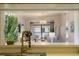 Bright living room view from the kitchen featuring modern chandelier and stylish decor at 4411 46Th W Ave # 201, Bradenton, FL 34210