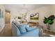 Bright living room with neutral furniture, a television, and open concept design at 4411 46Th W Ave # 201, Bradenton, FL 34210