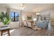 Inviting living room features natural light, contemporary furniture, and access to a private balcony at 4411 46Th W Ave # 201, Bradenton, FL 34210