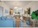 Bright living room with neutral furniture, a television, and open concept design at 4411 46Th W Ave # 201, Bradenton, FL 34210