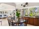 Comfortable lobby area with dining and seating arrangements and a view of the community at 4411 46Th W Ave # 201, Bradenton, FL 34210