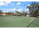 Well maintained tennis court surrounded by lush greenery, perfect for recreational enjoyment at 4411 46Th W Ave # 201, Bradenton, FL 34210