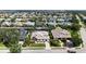 Aerial view of waterfront home in a residential neighborhood close to water at 4735 Starboard Dr, Bradenton, FL 34208