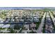 Aerial view of waterfront home in a residential neighborhood with access to waterway at 4735 Starboard Dr, Bradenton, FL 34208