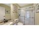 Bright bathroom featuring granite vanity and a glass-enclosed shower at 4735 Starboard Dr, Bradenton, FL 34208