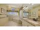 Bathroom with tile floors, bathtub, and a vanity with granite countertops at 4735 Starboard Dr, Bradenton, FL 34208