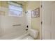 Bright bathroom featuring a bathtub, tiled shower, and neutral walls at 4735 Starboard Dr, Bradenton, FL 34208