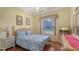 Cozy bedroom featuring a comfortable bed and a bright window view at 4735 Starboard Dr, Bradenton, FL 34208
