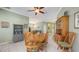 Spacious dining room with tile flooring and a wooden table with seating for eight at 4735 Starboard Dr, Bradenton, FL 34208