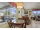 Dining room with a view of the pool, chandelier, tile floor, and open floor plan at 4735 Starboard Dr, Bradenton, FL 34208