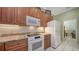 A bright kitchen featuring well-maintained appliances, and tile floors at 4735 Starboard Dr, Bradenton, FL 34208