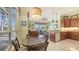 Dining area with view to the pool, and an open layout connects to the kitchen with granite countertops at 4735 Starboard Dr, Bradenton, FL 34208