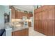Well-equipped kitchen with granite counters, tile backsplash, plenty of cabinet storage, and white appliances at 4735 Starboard Dr, Bradenton, FL 34208