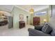 Cozy living room featuring tile flooring, natural light, and a decorative painting at 4735 Starboard Dr, Bradenton, FL 34208